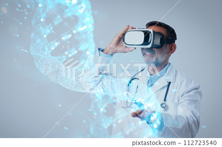 Senior doctor in white coat with stethoscope and vr glasses Senior doctor in white coat with stethoscope and vr glasses 112723540