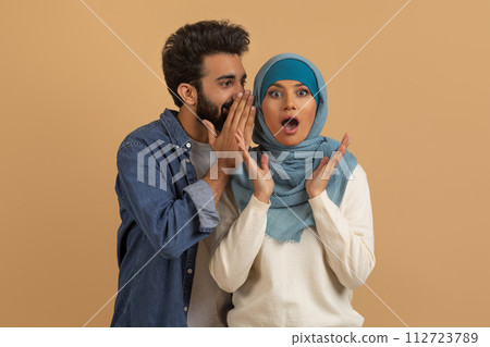 Big Secret. Arab Guy Gossiping With His Shocked Muslim Girlfriend In Hijab 112723789
