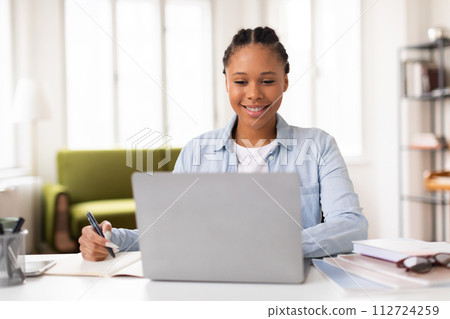 Happy lady student with laptop and pen ready to learn Happy lady student with laptop and pen ready to learn 112724259