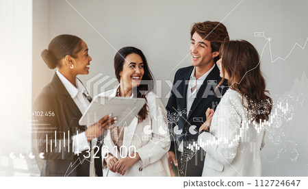 A diverse group of professional colleagues in smart attire laugh and collaborate 112724647