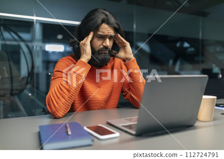 Stressed Eastern Businessman with Laptop at Office 112724791