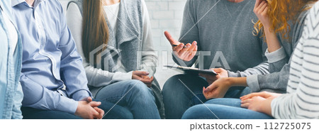 Therapist consulting patients of rehab group at therapy session Therapist consulting patients of rehab group at therapy session 112725075