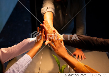 Collaborative High Five in a Business Setting Collaborative High Five in a Business Setting 112725136