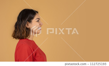 Side view smiling middle eastern woman looking at copy space 112725193