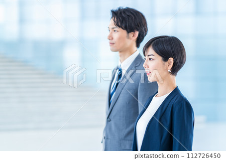 Business people (men and women) lined up in the aisle Business people (men and women) lined up in the aisle 112726450