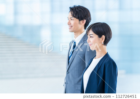 Business people (men and women) lined up in the aisle 112726451
