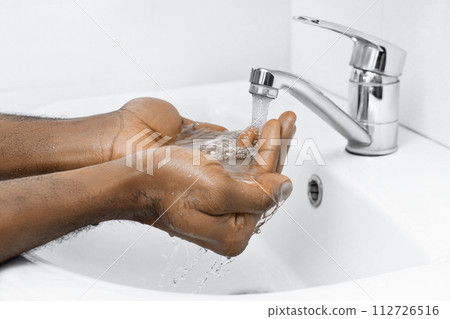 hand washing in bathroom 112726516