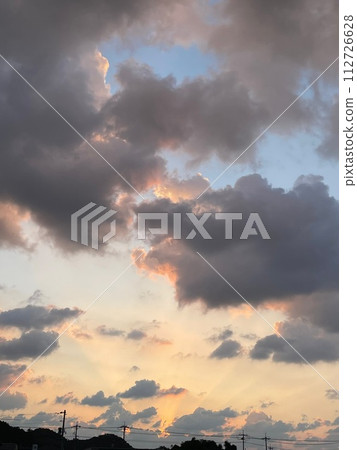 Sunset sky seen through the clouds Sunset sky seen through the clouds 112726628