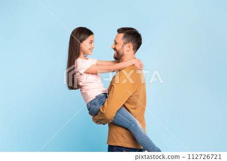 Happy Father Carrying His Little Daughter In Hug, Studio Happy Father Carrying His Little Daughter In Hug, Studio 112726721