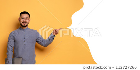 Asian man holds laptop pointing to empty speech bubble , collage 112727266