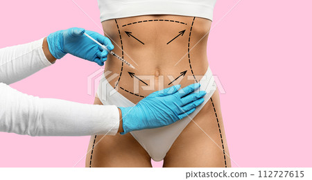 Unrecognizable woman in underwear getting injection in belly 112727615