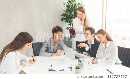 Creative business team brainstorming at group meeting 112727757