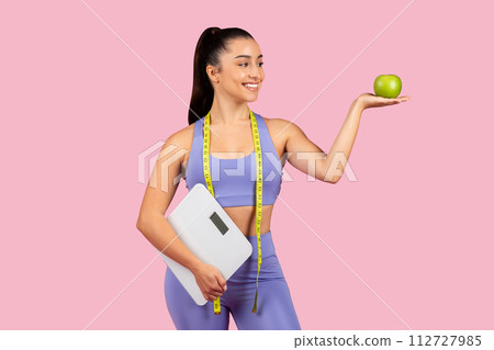 Healthy balance with scale, apple, and fitness Healthy balance with scale, apple, and fitness 112727985