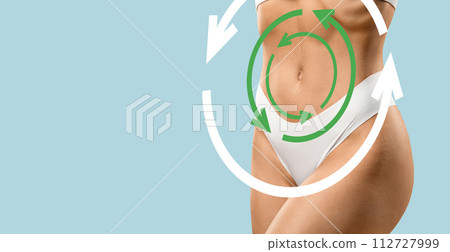 Circle arrows over well-fit lady waist, cropped 112727999