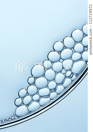 A close-up photo of water droplets that can be used in science, medicine, ingredients, and beauty designs. 112729972