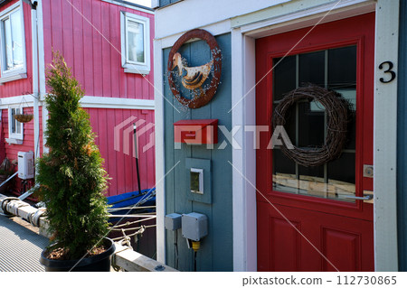 fisherman's wharf Victoria British Columbia, Canada Fisherman's wharf House Boat Homes float on Vancouver Island BC Boats and Yachts at Fisherman's Wharf Marina in the Inner Harbour. High quality 4k 112730865