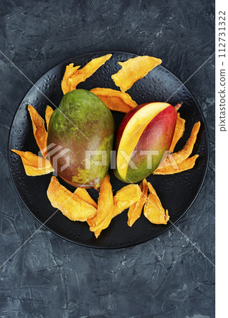 Dried, raw and candied mango 112731322