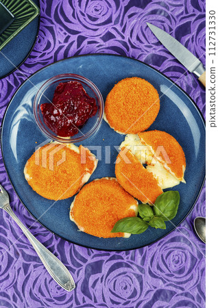Baked Camembert cheese with berry sauce 112731330