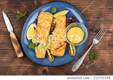 Pollock fillet baked in breadcrumbs Pollock fillet baked in breadcrumbs 112731349