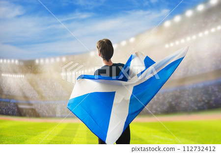Scotland football team supporter on stadium. Scotland football team supporter on stadium. 112732412