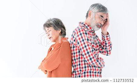Senior couple thinking back to back Senior couple thinking back to back 112733552