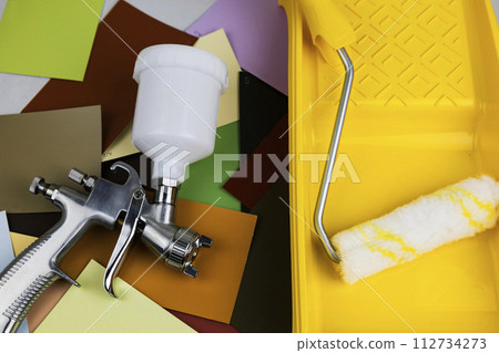 Paint spray gun at work at the workplace in the workshop. Paint Brush Paint spray gun at work at the workplace in the workshop. Paint Brush 112734273