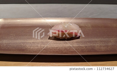 Fresh yellowtail sushi on a plate 112734627