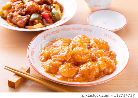 Stir-fried shrimp with chili sauce and sweet and sour pork Stir-fried shrimp with chili sauce and sweet and sour pork 112734737