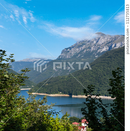 Piva Lake (Pivsko Jezero) and Pluzine town view in Montenegro. 112735813