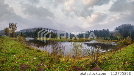 Foggy and overcast autumn day in Carpathian Mountains. Rika river bend, Transcarpathia, Ukraine. Foggy and overcast autumn day in Carpathian Mountains. Rika river bend, Transcarpathia, Ukraine. 112735898