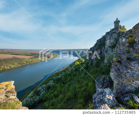 Amazing spring view on the Dnister River Canyon with picturesque rocks, fields, flowers. This place named Shyshkovi Gorby,  Nahoriany, Chernivtsi region, Ukraine. 112735905