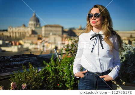 Woman in white shirt and blue jeans in Rome 112736178
