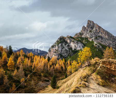 Autumn Dolomites mountain scene, Falzarego Pass, Italy 112736183
