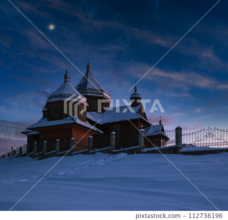 Night countryside hills, groves and farmlands in winter remote alpine mountain village. Ukraine, Voronenko. 112736196