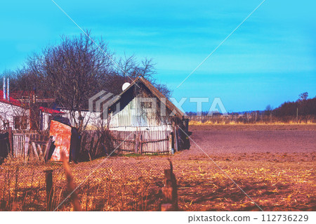 View of the countryside in early spring. View of cultivated land near the village View of the countryside in early spring. View of cultivated land near the village 112736229