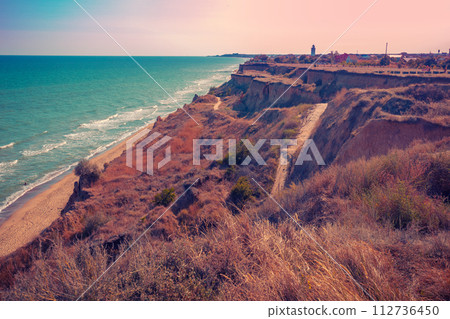 Seascape with the sea and a steep clay coast. Ukraine 112736450