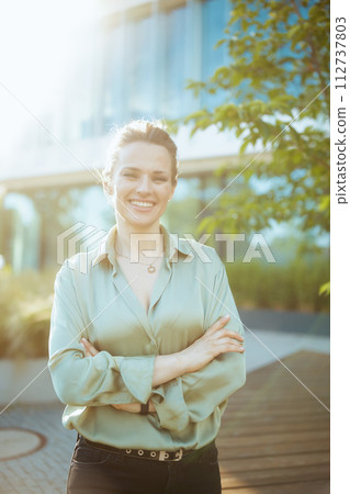smiling modern business woman in business district 112737803