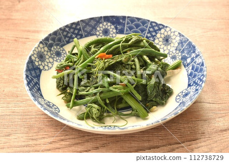 fried Chayote sprout with chili and soybean sauce on plate fried Chayote sprout with chili and soybean sauce on plate 112738729
