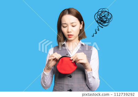 Disappointed woman looking at empty wallet Disappointed woman looking at empty wallet 112739292