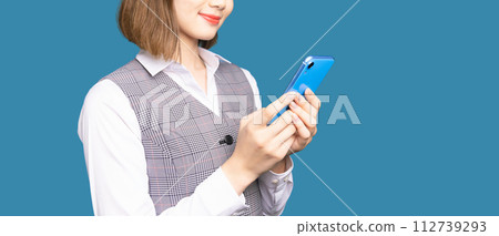 A woman using a smartphone A woman using a smartphone 112739293