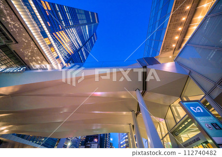 Tokyo cityscape in Japan View of Toranomon Hills Station Tower, which opened today. On the right is the Glass Rock building (night view) 112740482