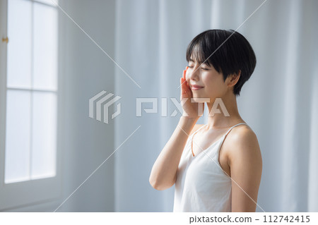A young woman doing skin care A young woman doing skin care 112742415