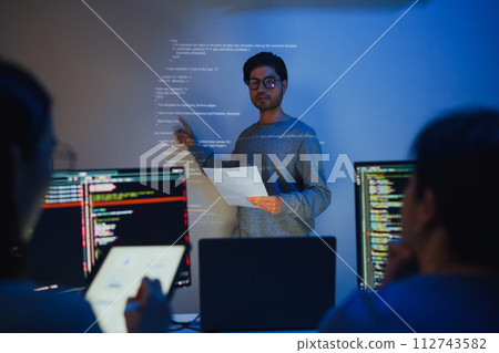 asian and Indian developer team brainstorming and presentation about ai coding project at night in office asian and Indian developer team brainstorming and presentation about ai coding project at night in office 112743582