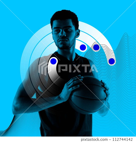 Concentrated young man, basketball player standing with ball against blue background with health tracking graphics. Monochrome 112744142