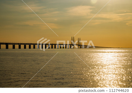 Oresund Bridge on sunset, between Sweden and Denmark, Malmo Oresund Bridge on sunset, between Sweden and Denmark, Malmo 112744620