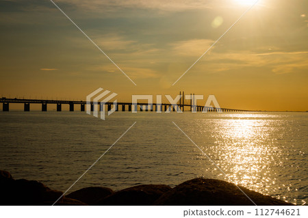 Oresund Bridge on sunset, between Sweden and Denmark, Malmo Oresund Bridge on sunset, between Sweden and Denmark, Malmo 112744621