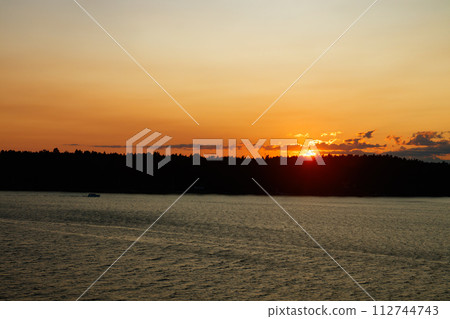 Magical sunset over the Gulf of Finland, Baltic sea. View from the ship 112744743