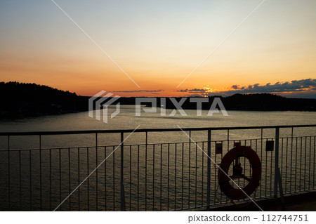 Magical sunset over the Gulf of Finland, Baltic sea. View from the ship 112744751