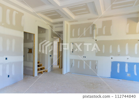 New home construction with gypsum plaster walls drywall ready for painting New home construction with gypsum plaster walls drywall ready for painting 112744840