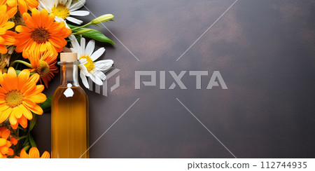 Flat lay, floral essential oil bottle with space for text Flat lay, floral essential oil bottle with space for text 112744935